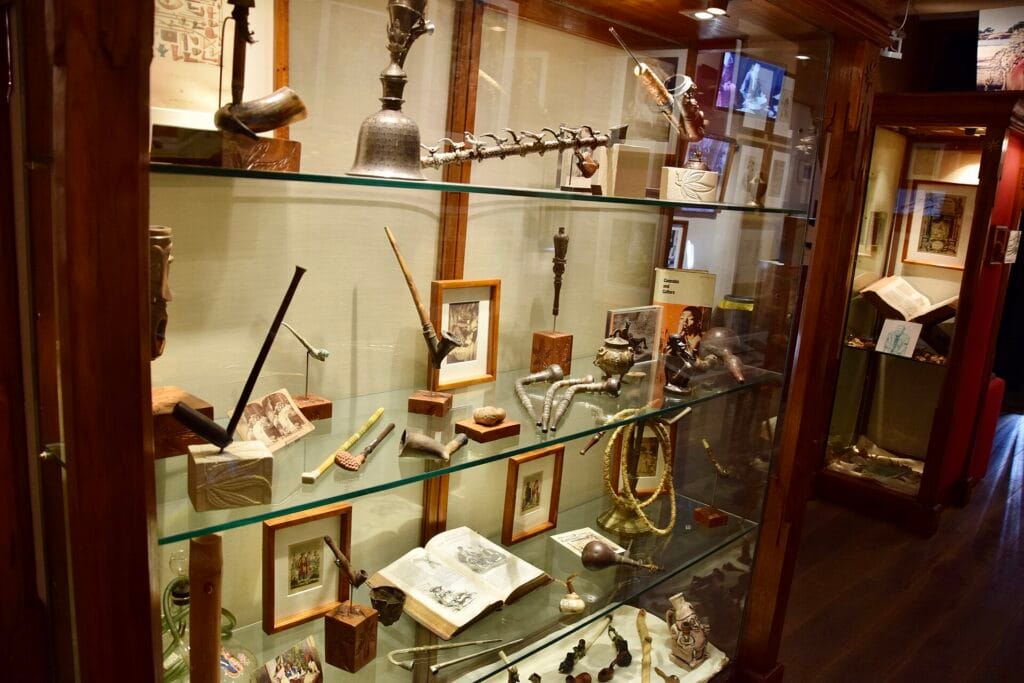Display cases with pipes and objects at the Hash Marihuana & Hemp Museum in Amsterdam