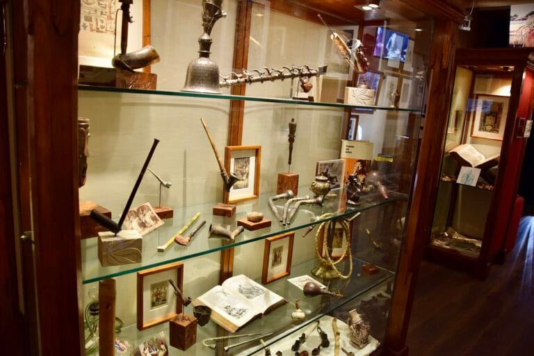 Display cases with pipes and objects at the Hash Marihuana & Hemp Museum in Amsterdam