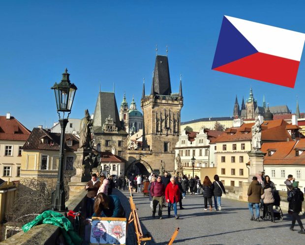 Charles Bridge in Prague with the Czech flag, connected to the article about Cannafest and Czechia’s upcoming cannabis legalisation.