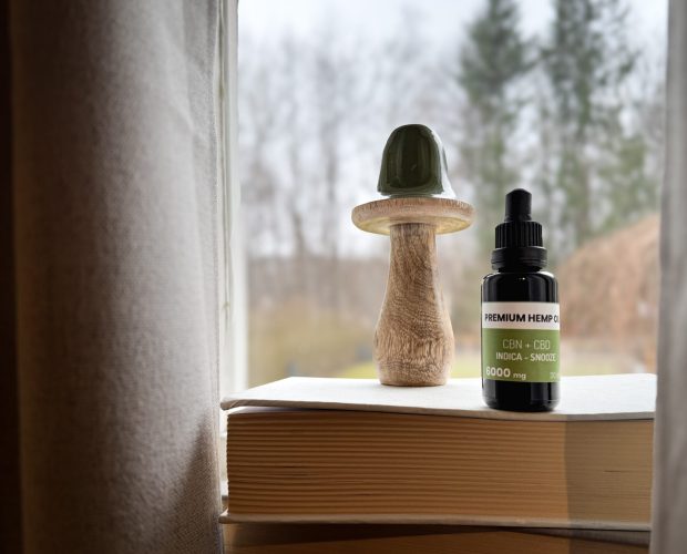 CBN oil and wooden object by window